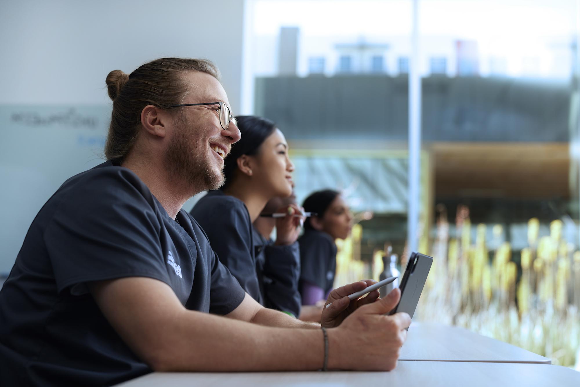 Alliant Nursing Student Holding a Tablet in Class